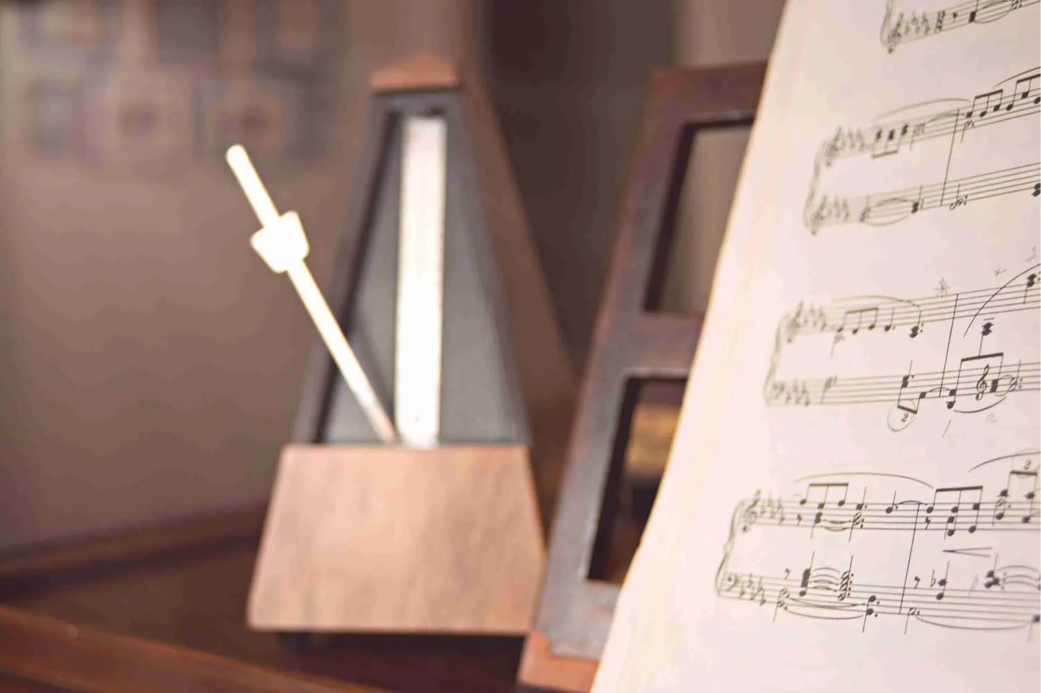 Metronome beside sheet music