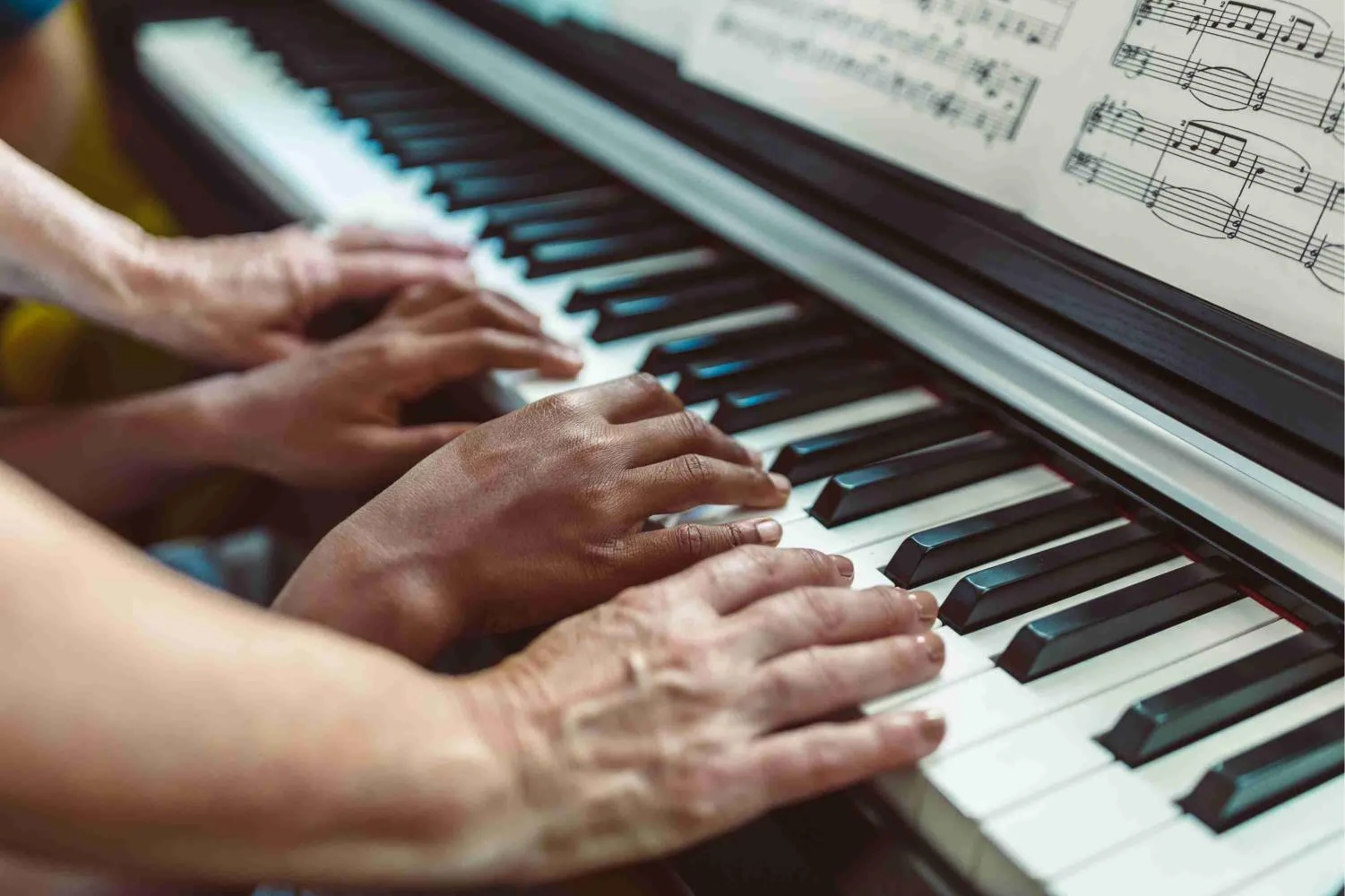 Hands playing piano